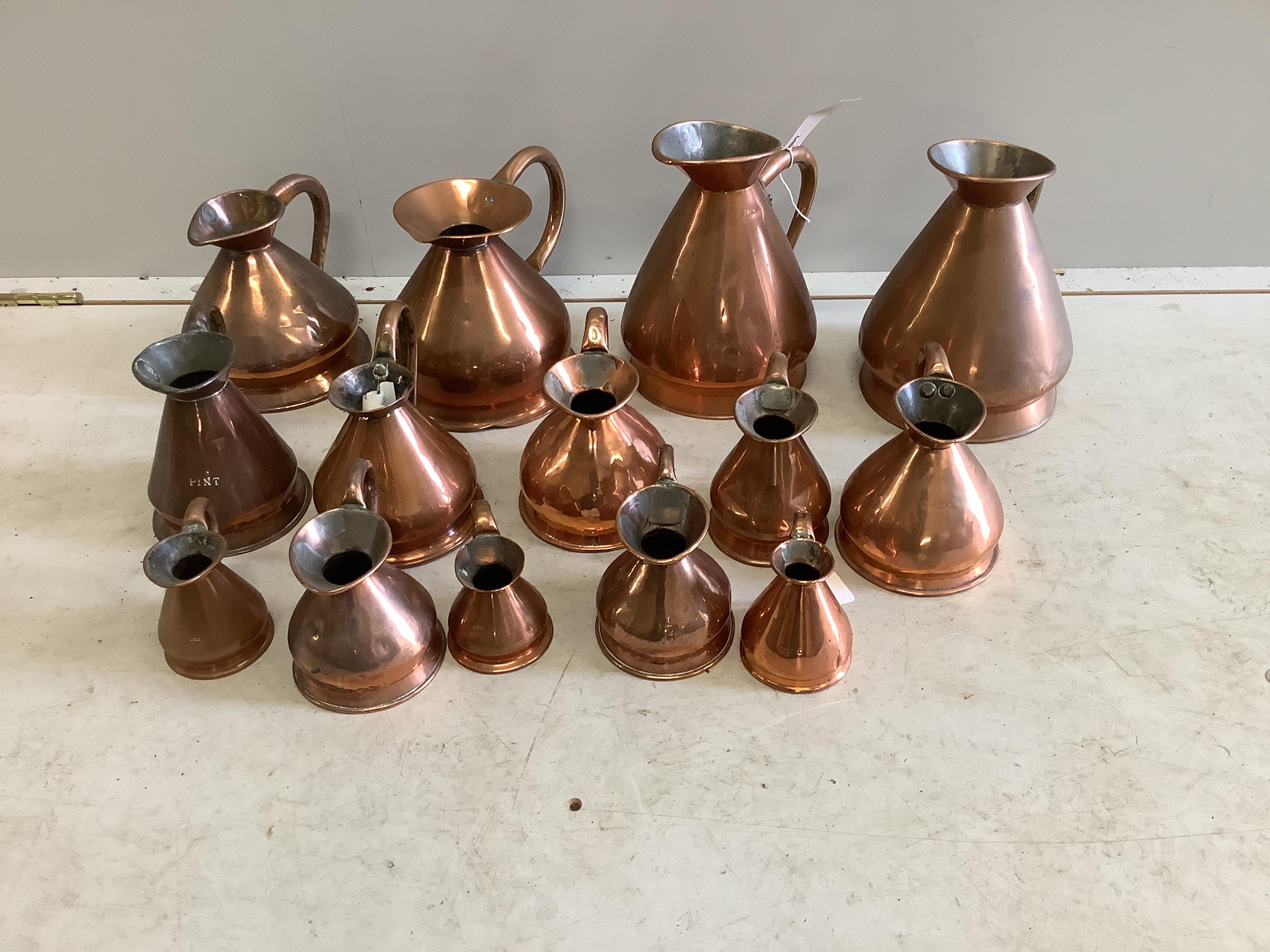 Fourteen 19th / early 20th century copper haystack measures, half gallon to one gill, largest height 23cm